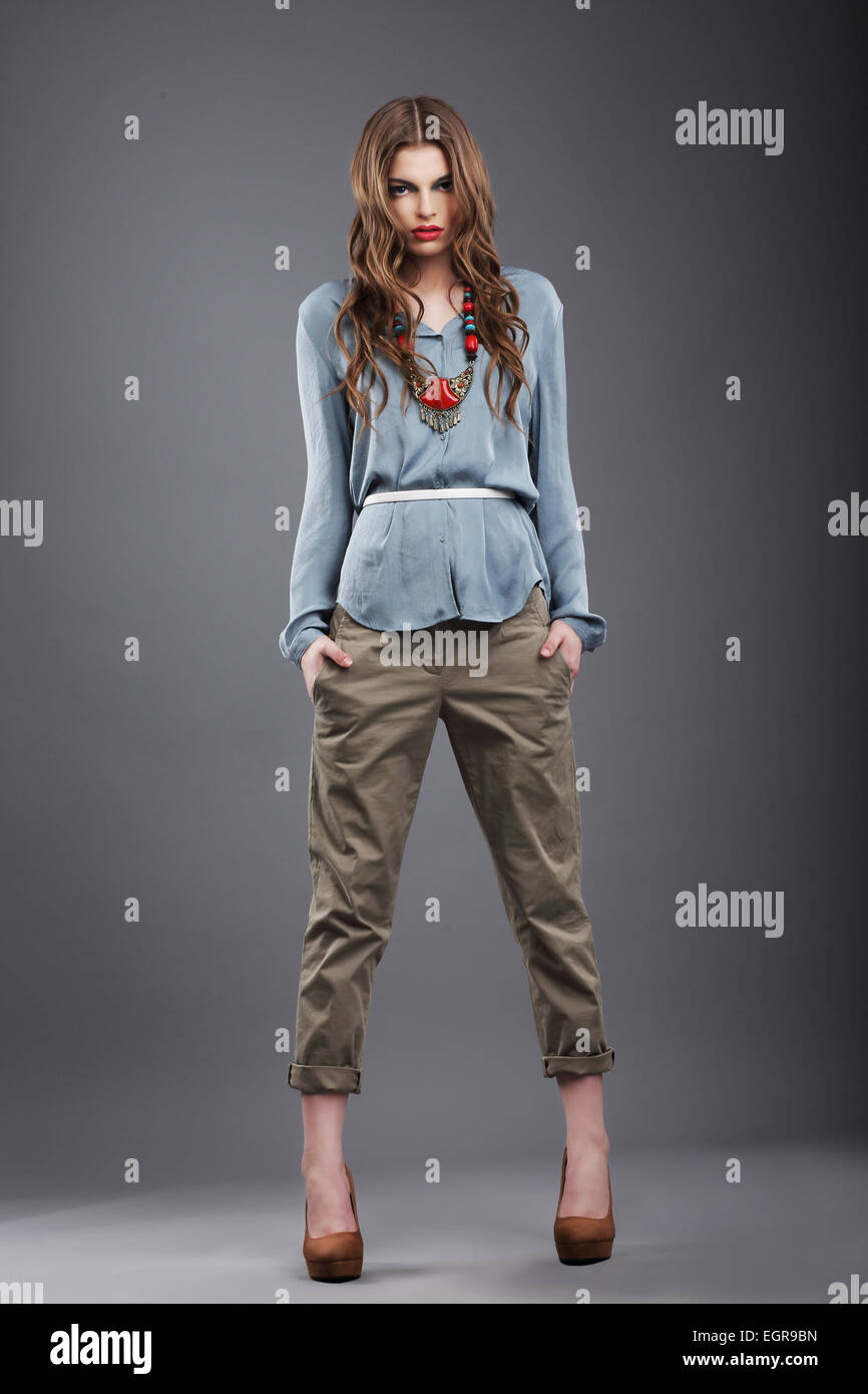 Individuality. Trendy Fashion Model in Pants Stock Photo