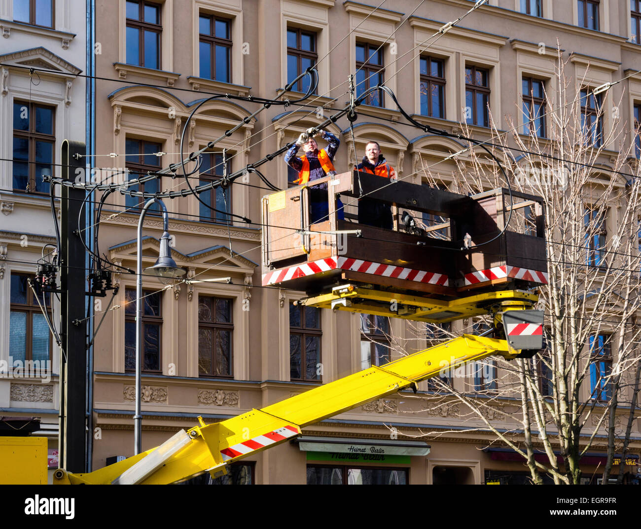 Berlin tram repair and safety service - truck and two engineers repairing overhead tram wires, Germany Stock Photo