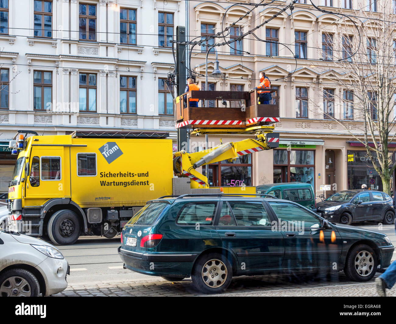 Berlin tram repair and safety service - truck and two engineers repairing overhead tram wires, Germany Stock Photo