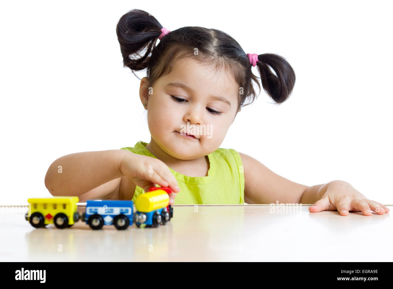 Cute kid girl playing trains Stock Photo Alamy
