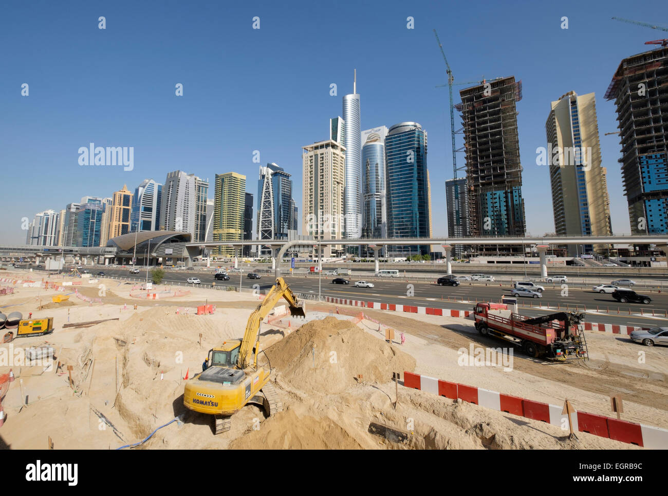 Skyline of Jumeirah Lakes Towers (JLT) and Sheikh Zayed Road with construction site in Dubai United Arab Emirates Stock Photo