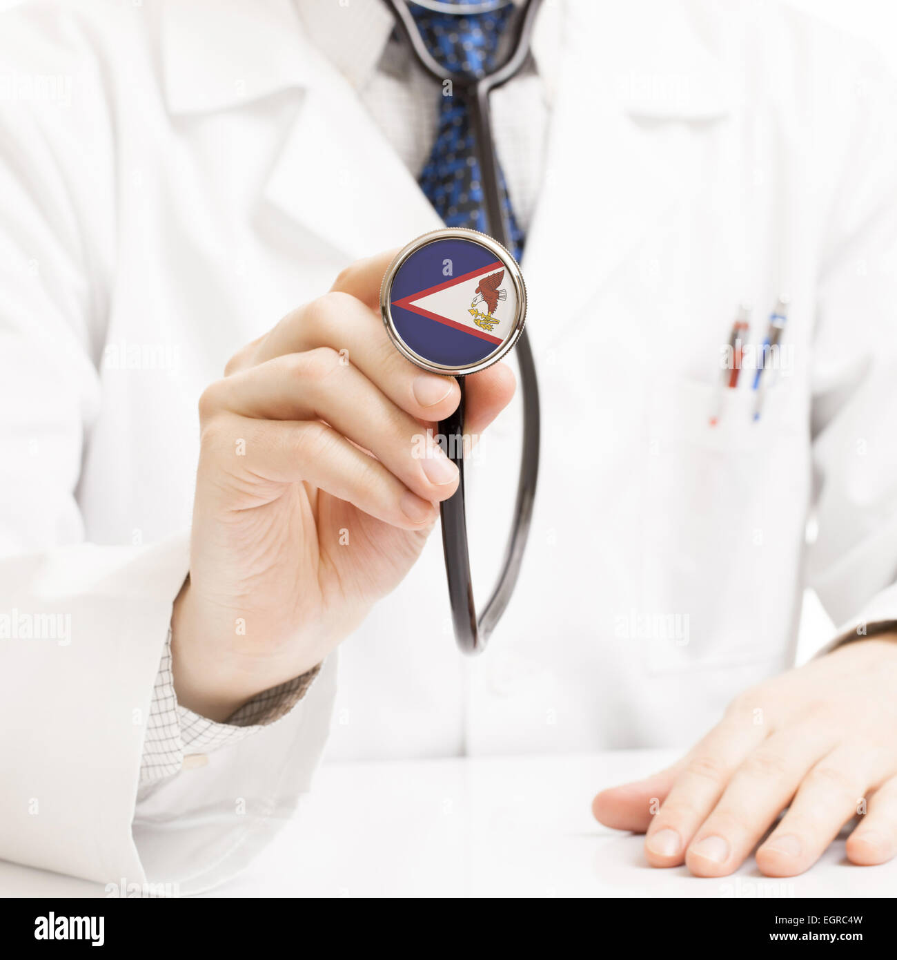 Doctor holding stethoscope with flag series - American Samoa Stock Photo