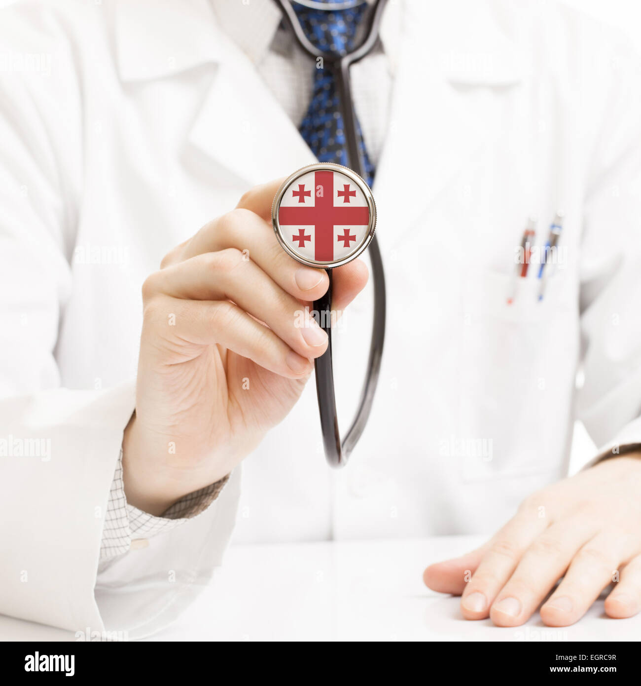 Doctor holding stethoscope with flag series - Georgia Stock Photo