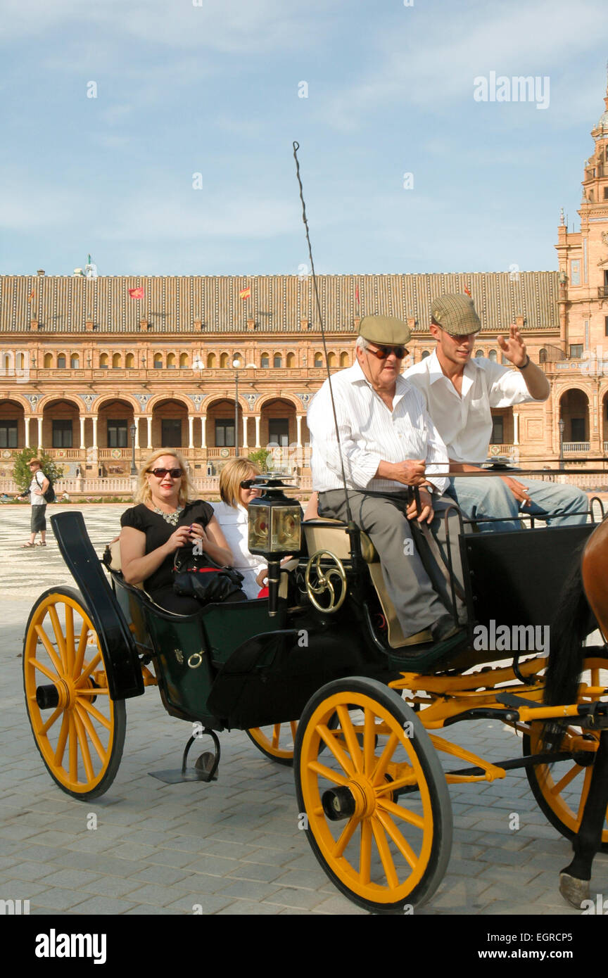 Tourists take a carriage ride at Plaza de España, Seville, Spain, Espana Stock Photo