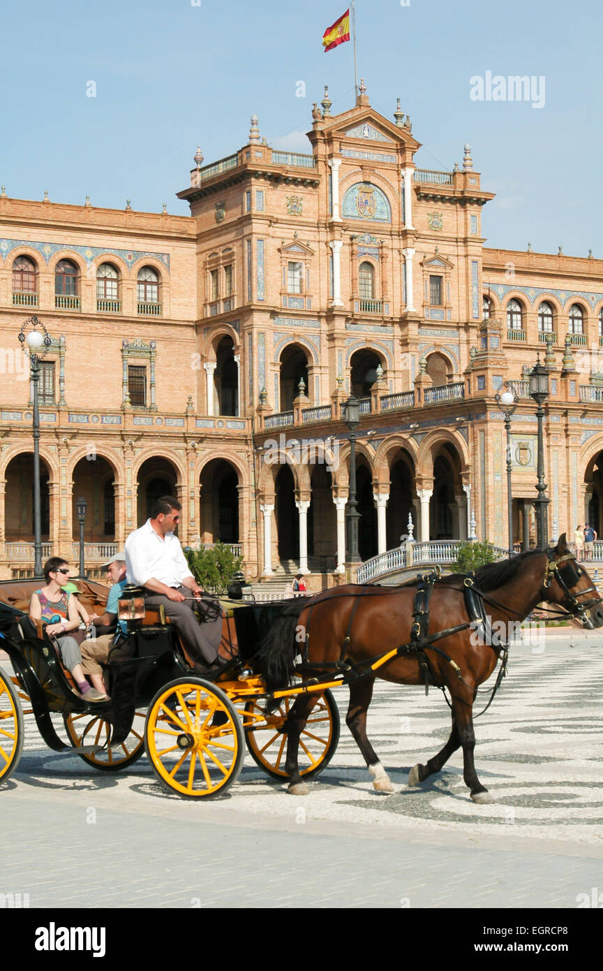 Tourists take a carriage ride at Plaza de España, Seville, Spain, Espana Stock Photo