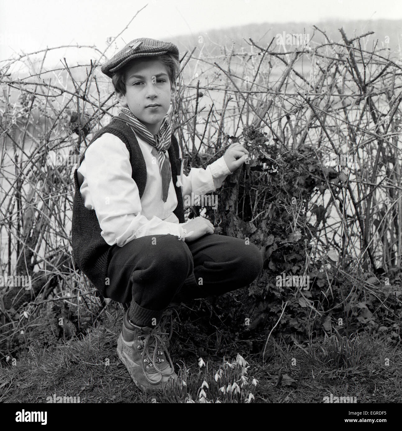 Portrait of young boy dressed for St. David's Day celebrations at village school posing for photo in rural Wales UK  KATHY DEWITT Stock Photo