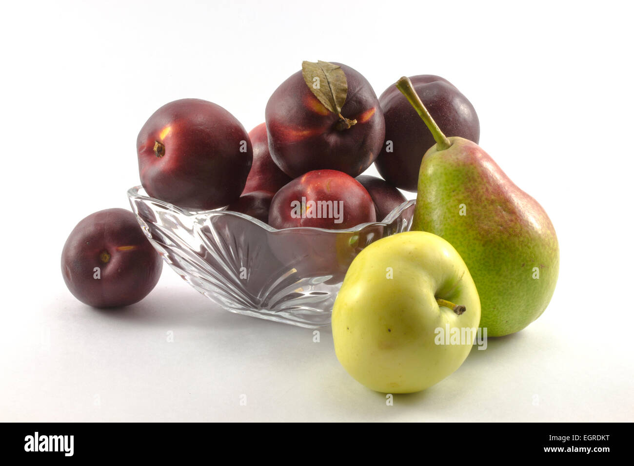 Pears, peaches, apples on a crystal plate Stock Photo