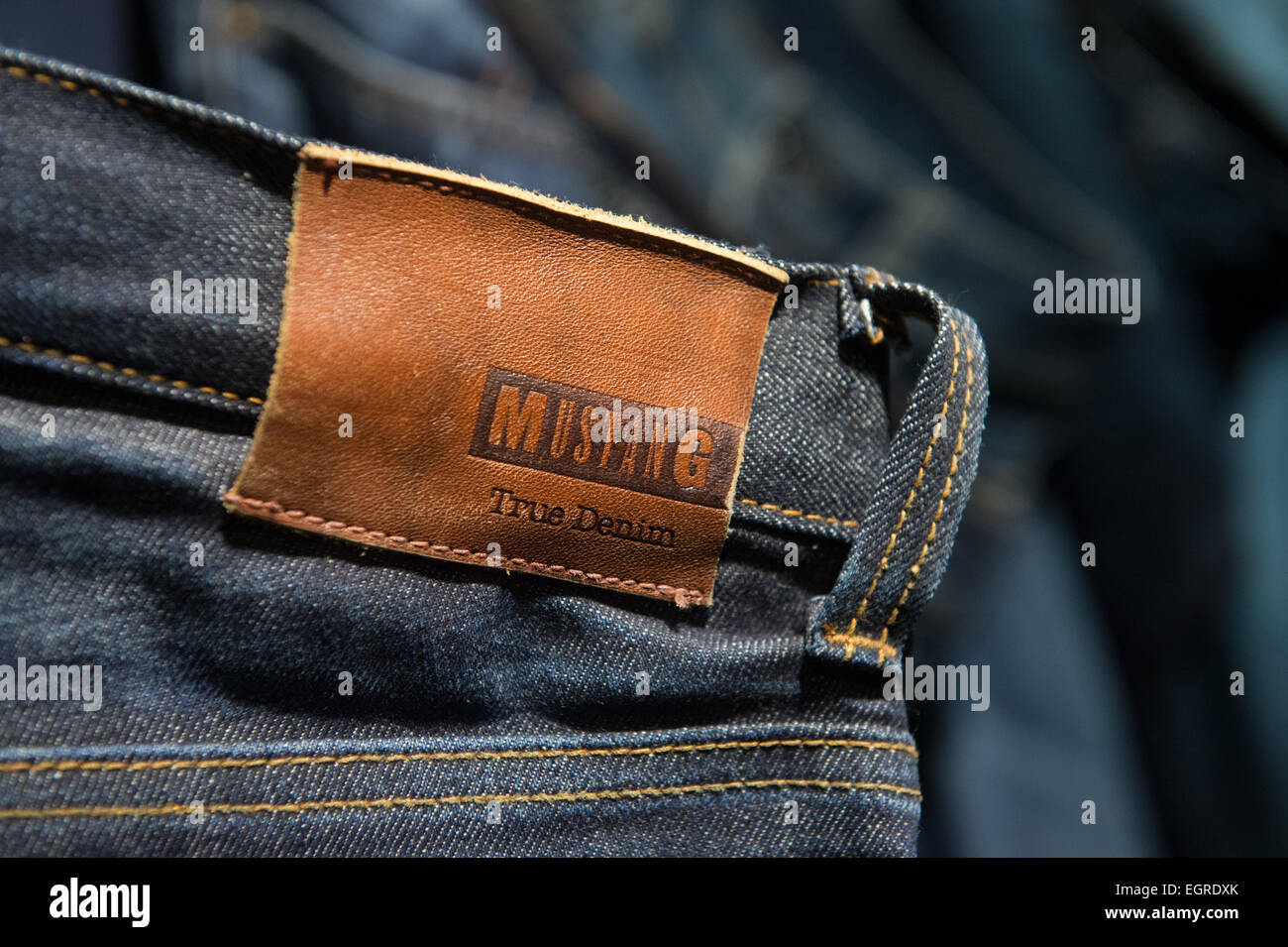 Kuenzelsau, Germany. 26th Feb, 2015. The company logo of jeans manufacturer  Mustang is on display on a pair of jeans at the company's headquarter and  main production facility site in Kuenzelsau, Germany,