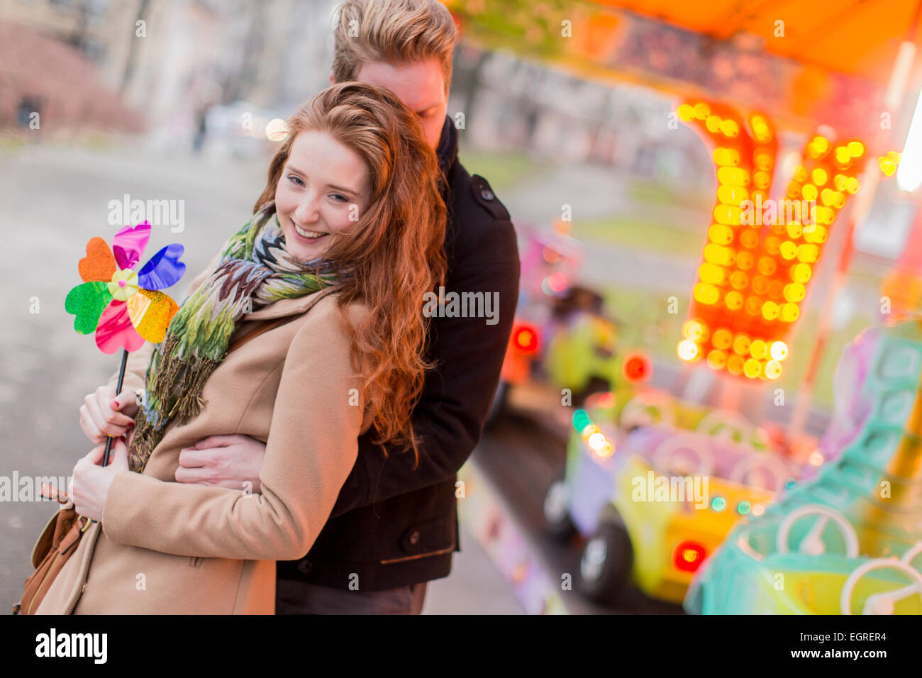 Young couple in the amusement park Stock Photo - Alamy