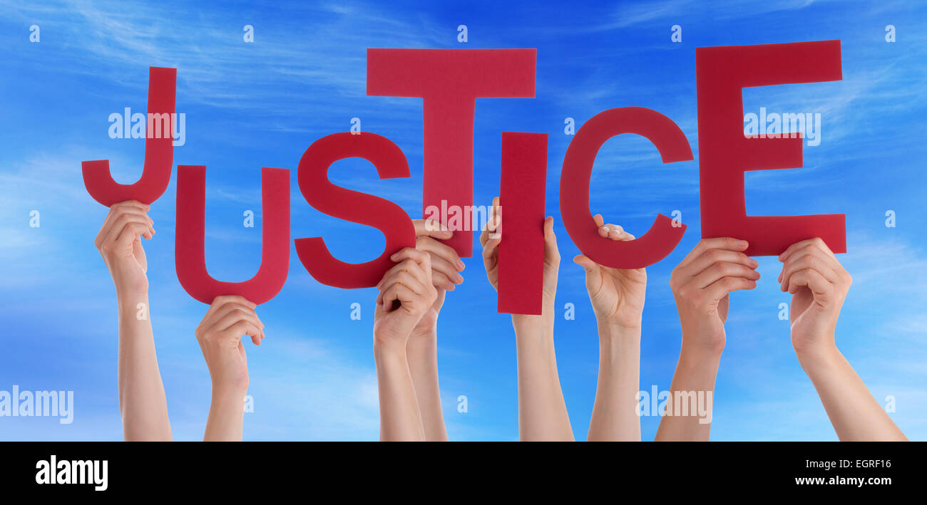 Many Caucasian People And Hands Holding Red Letters Or Characters Building The English Word Justice On Blue Sky Stock Photo