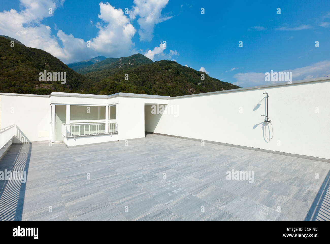 large terrace of a modern white house Stock Photo