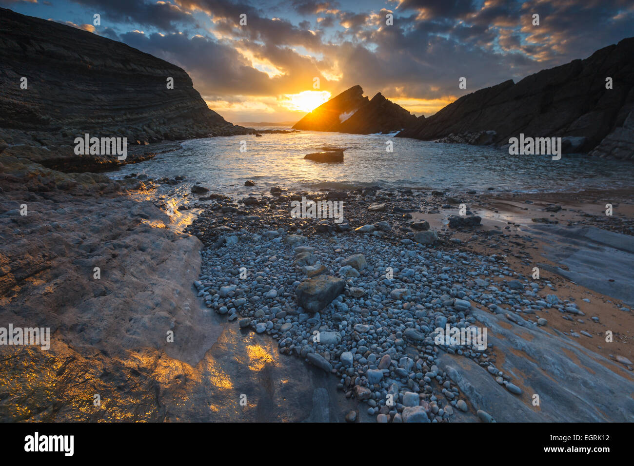 El Madero beach by sunset. Liencres, Cantabria, Spain. Stock Photo