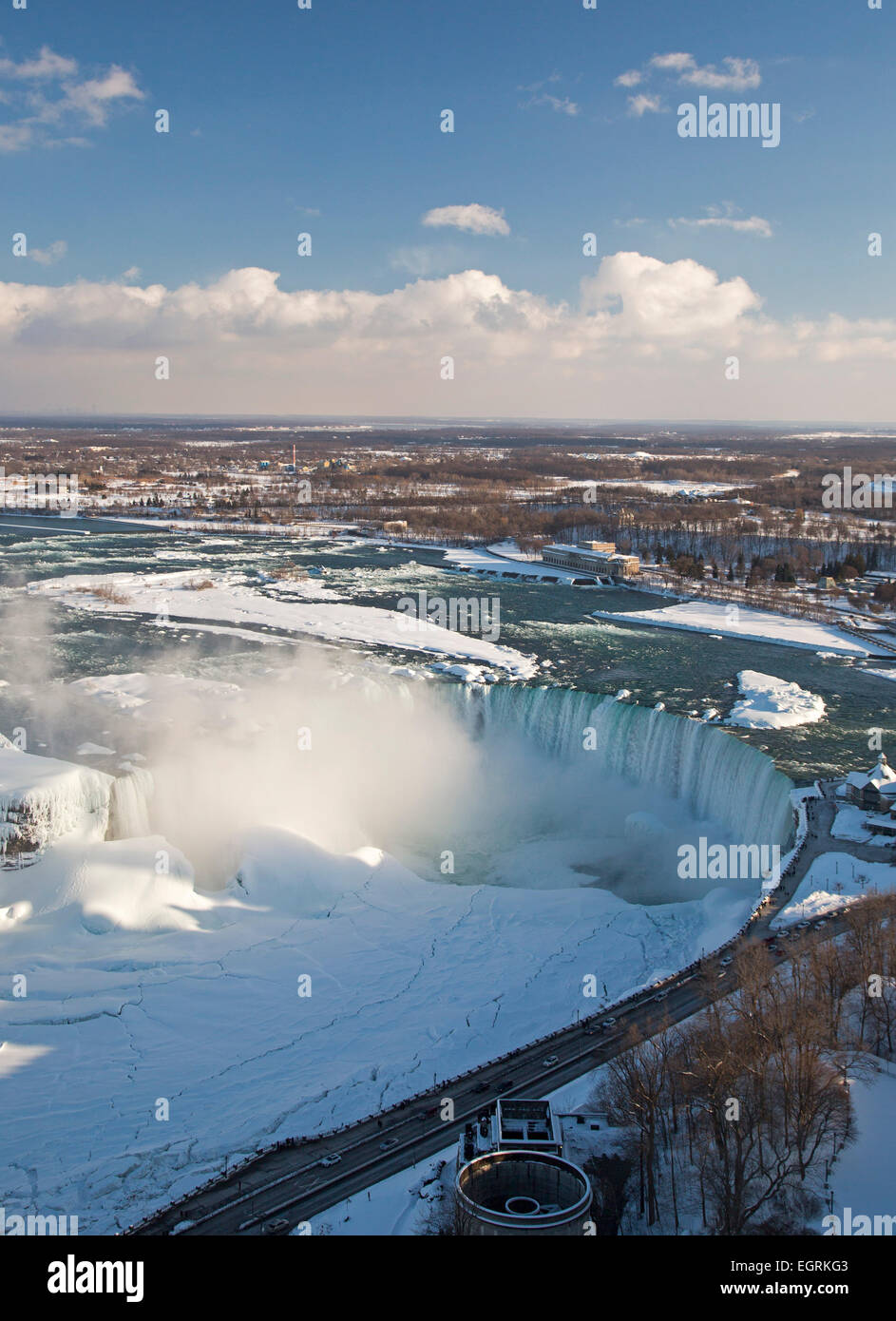 Niagara Falls, Ontario - Niagara Falls in winter. The Canadian Falls, or Horseshoe Falls, flows into the frozen Niagara River. Stock Photo