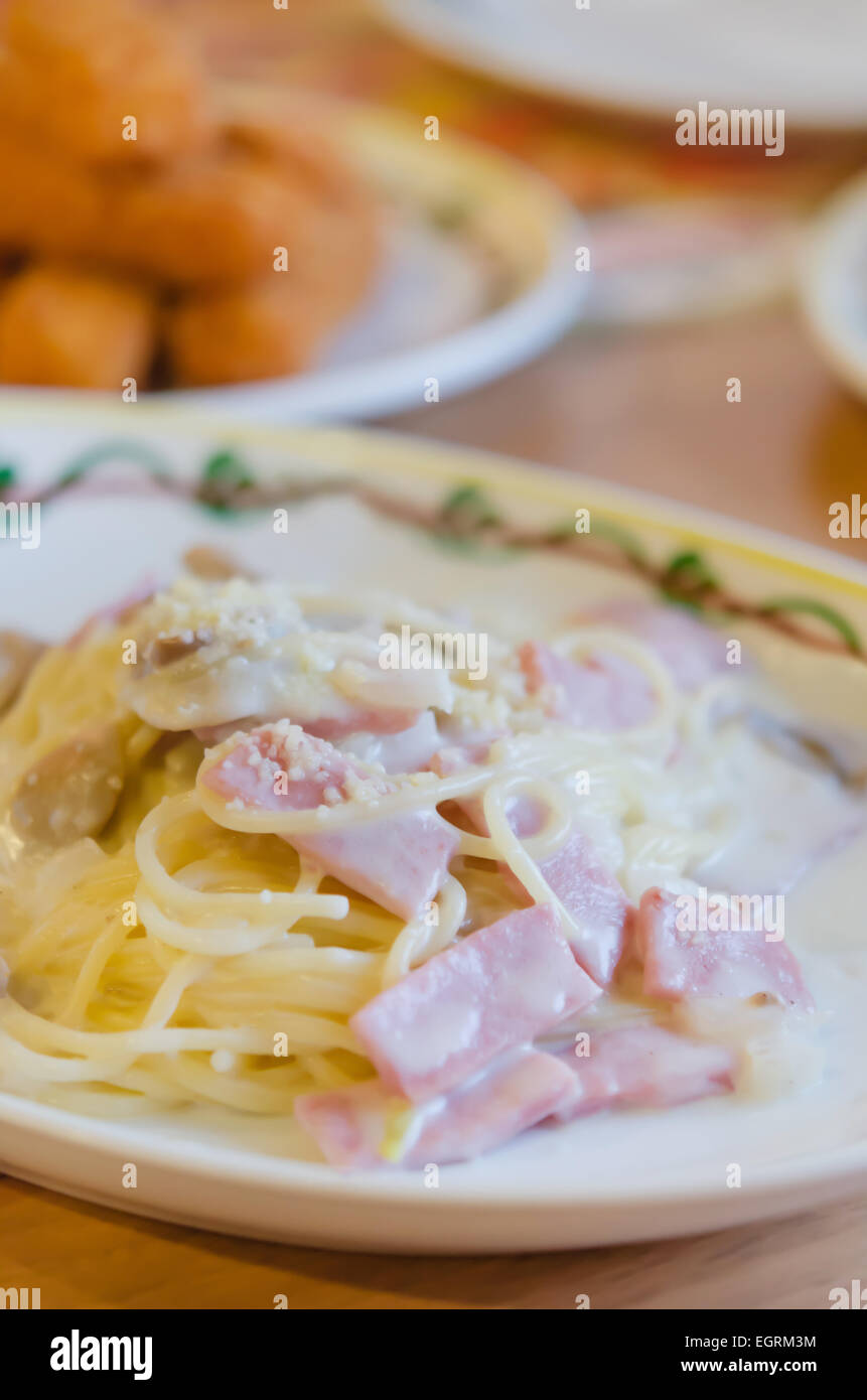 Spaghetti Carbonara with bacon and cheese on dish Stock Photo