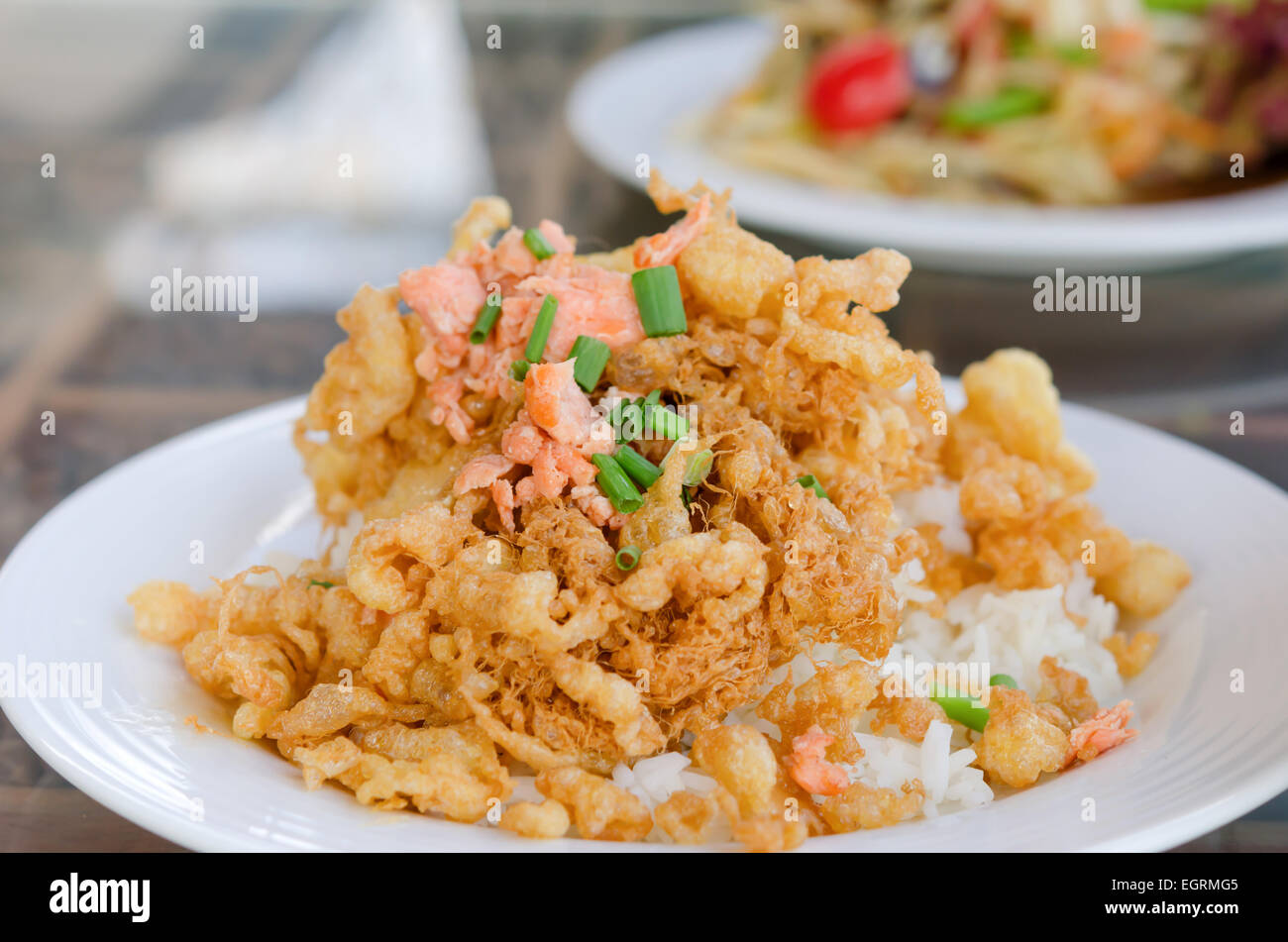 fried crispy beaten egg omelette served with steamed rice Stock Photo