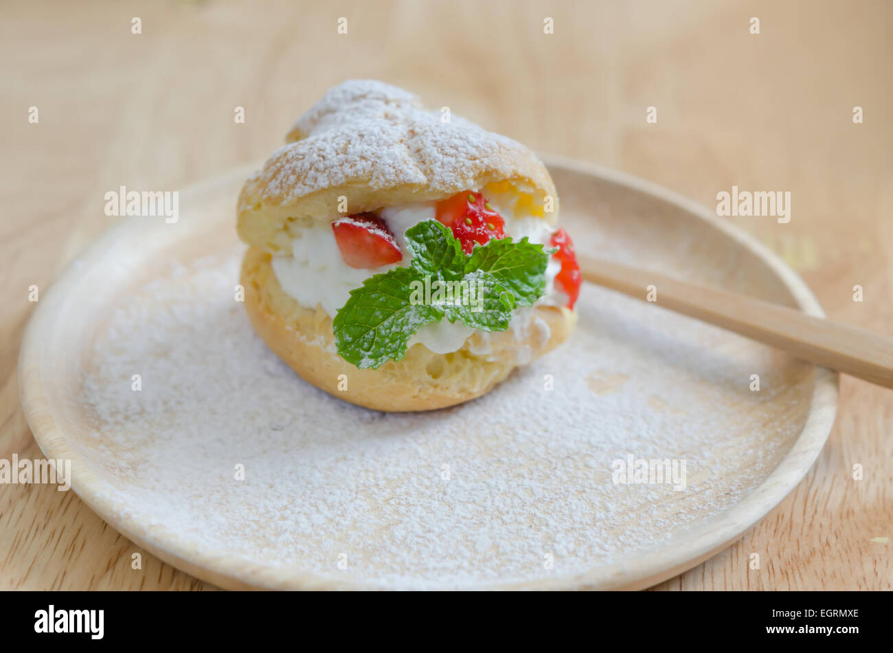 fresh strawberry Choux Cream on wooden dish Stock Photo