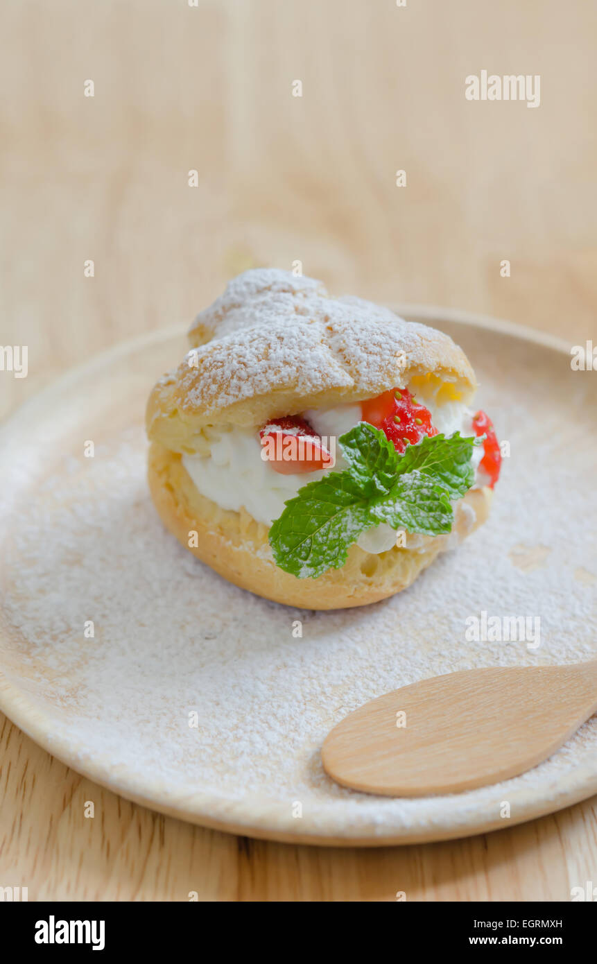 fresh strawberry Choux Cream on wooden dish Stock Photo