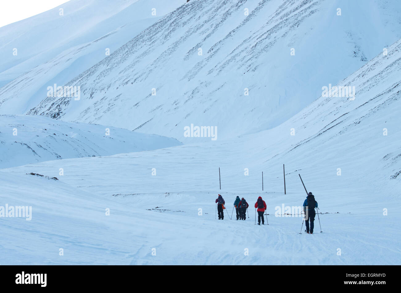 Skiiers on their way towards Longyear Glacier, Svalbard Stock Photo