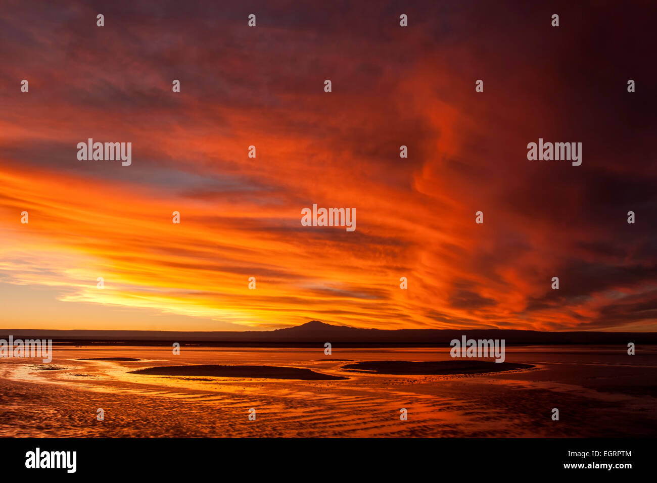 Sunset clouds over Chaxa Lagoon, The Flamingos National Reserve, Soncor Sector, Salar de Atacama, Chile Stock Photo