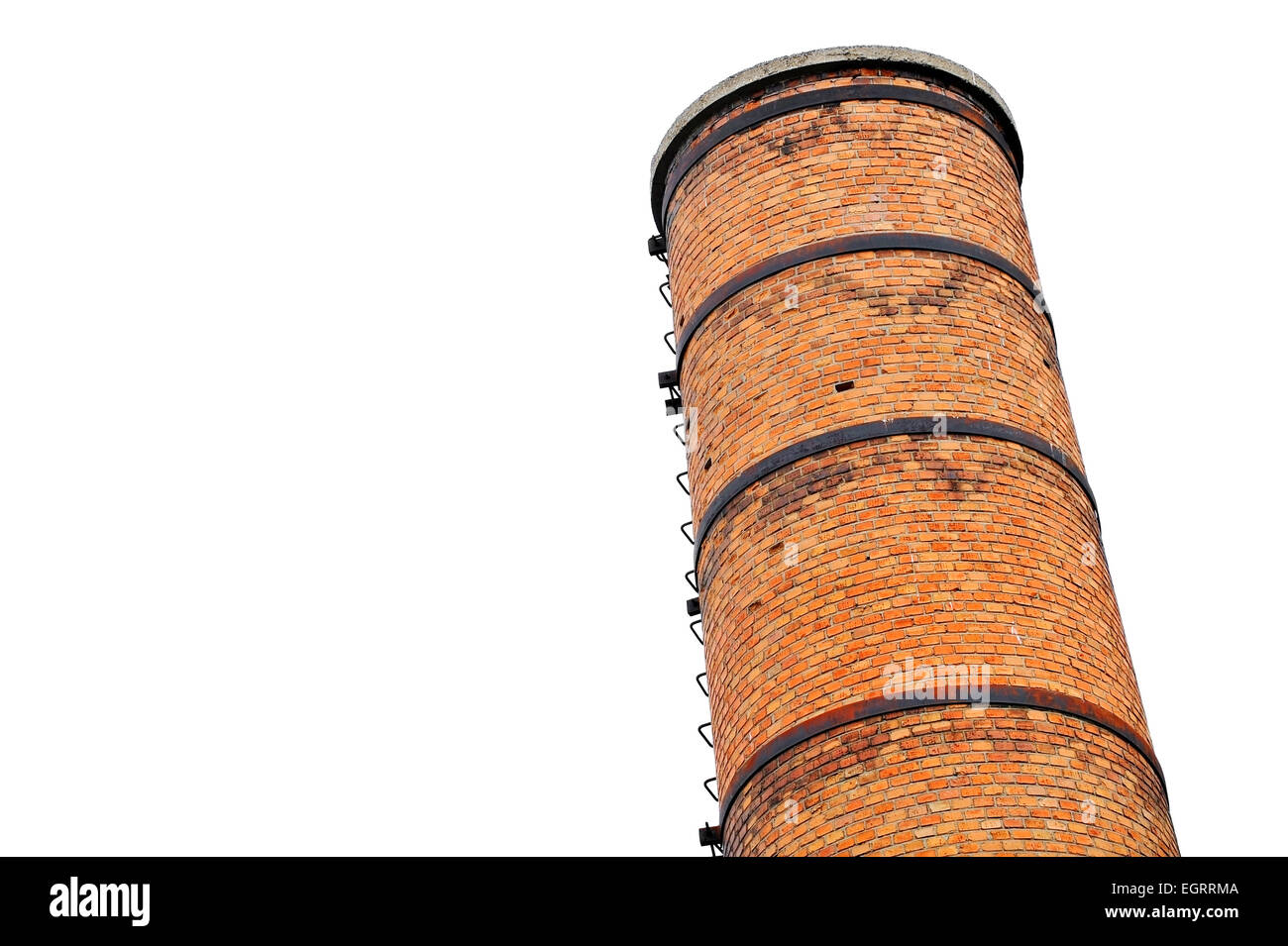 Architecture shot with an old industrial brick tower isolated on white background Stock Photo