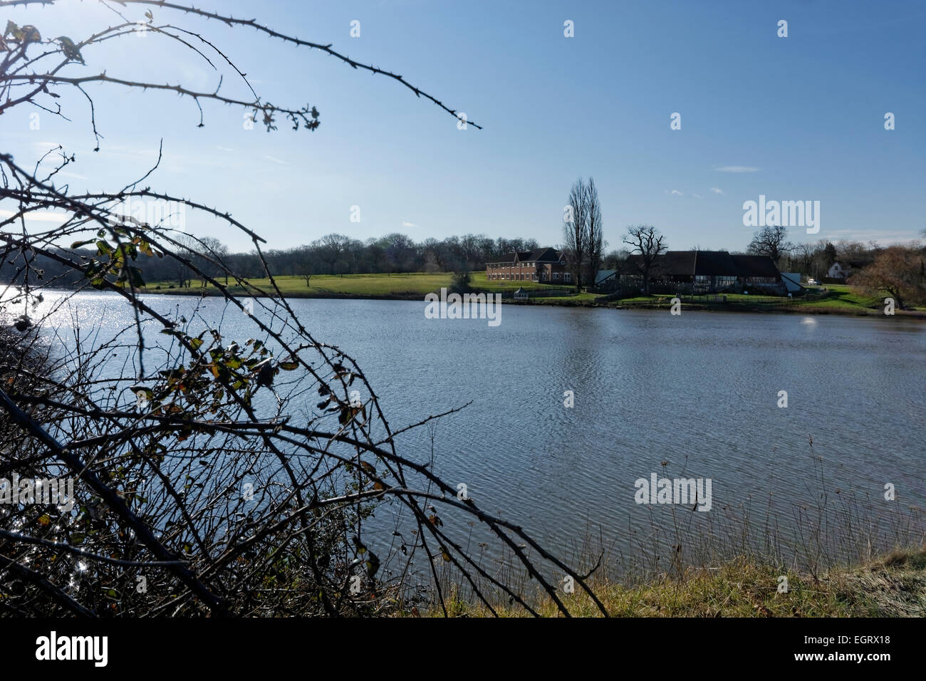 The pond on the landward side of Wootton Bridge, isle of Wight, UK that contains a sluice to the sea. Stock Photo