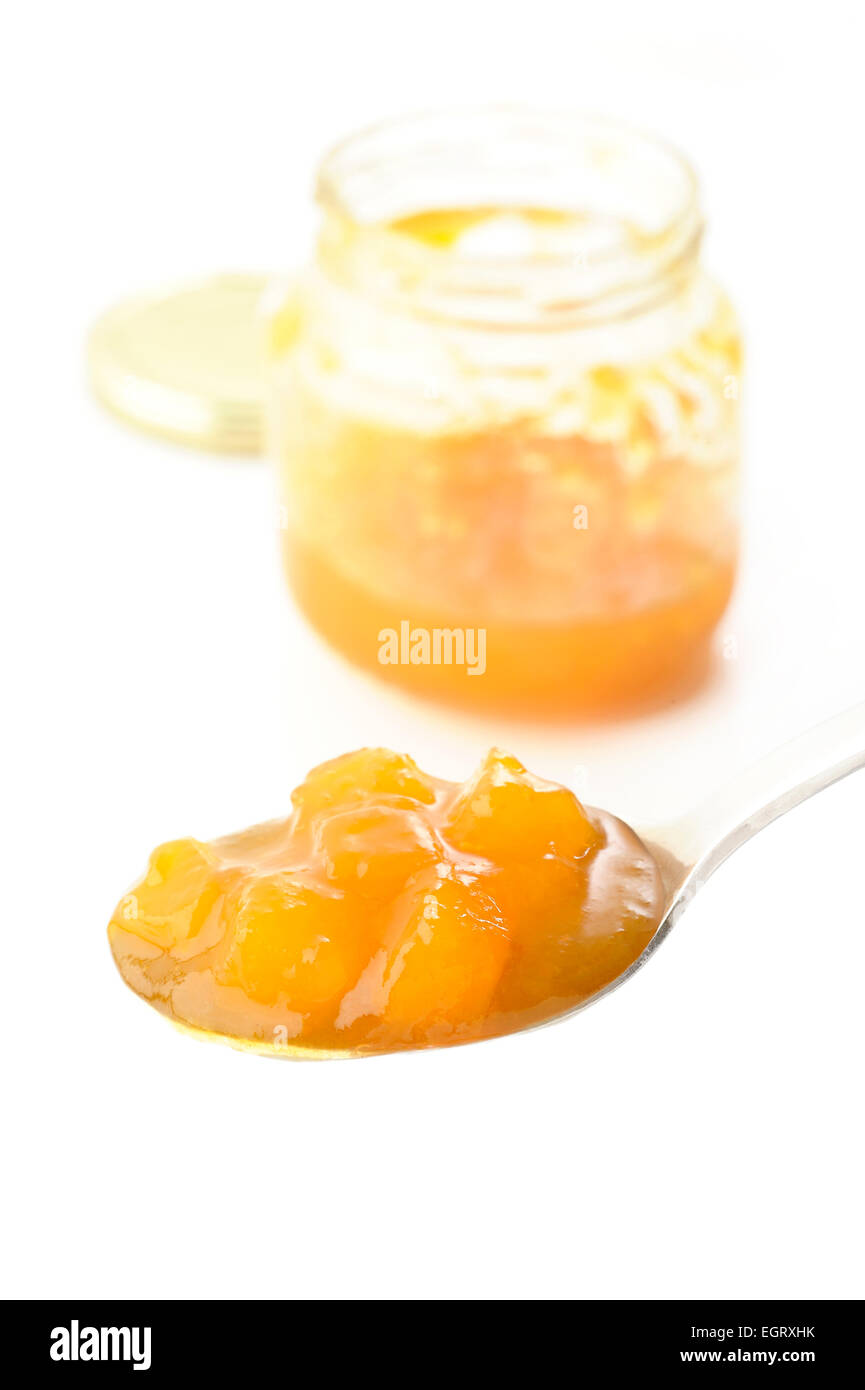 peach jam in spoon Stock Photo Alamy