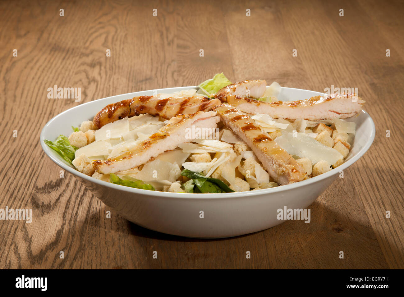 Chicken Caesar salad lettuce green vegetable bread crust cubes vinegar