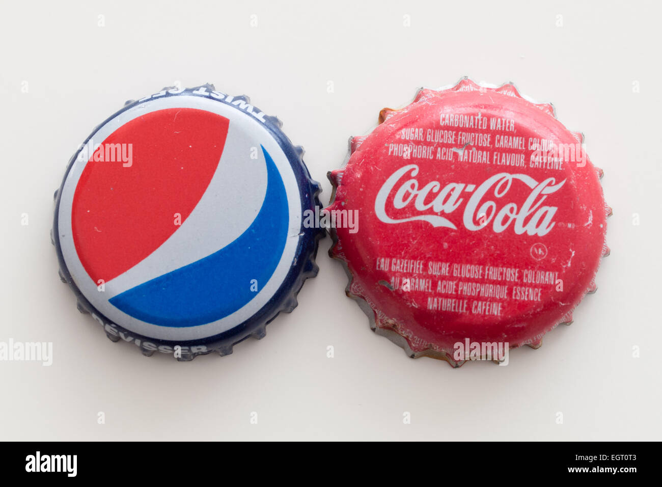 A Pepsi bottle cap and a Coca-Cola bottle cap Stock Photo - Alamy