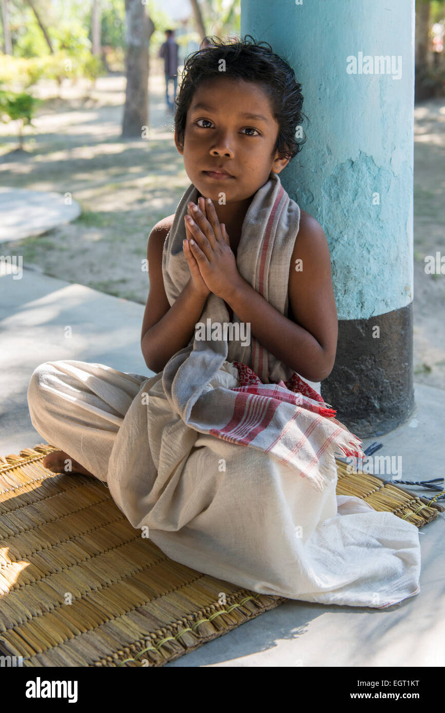 Young Monk Praying, Uttar Kamalabari Satra, Majuli Island Stock Photo