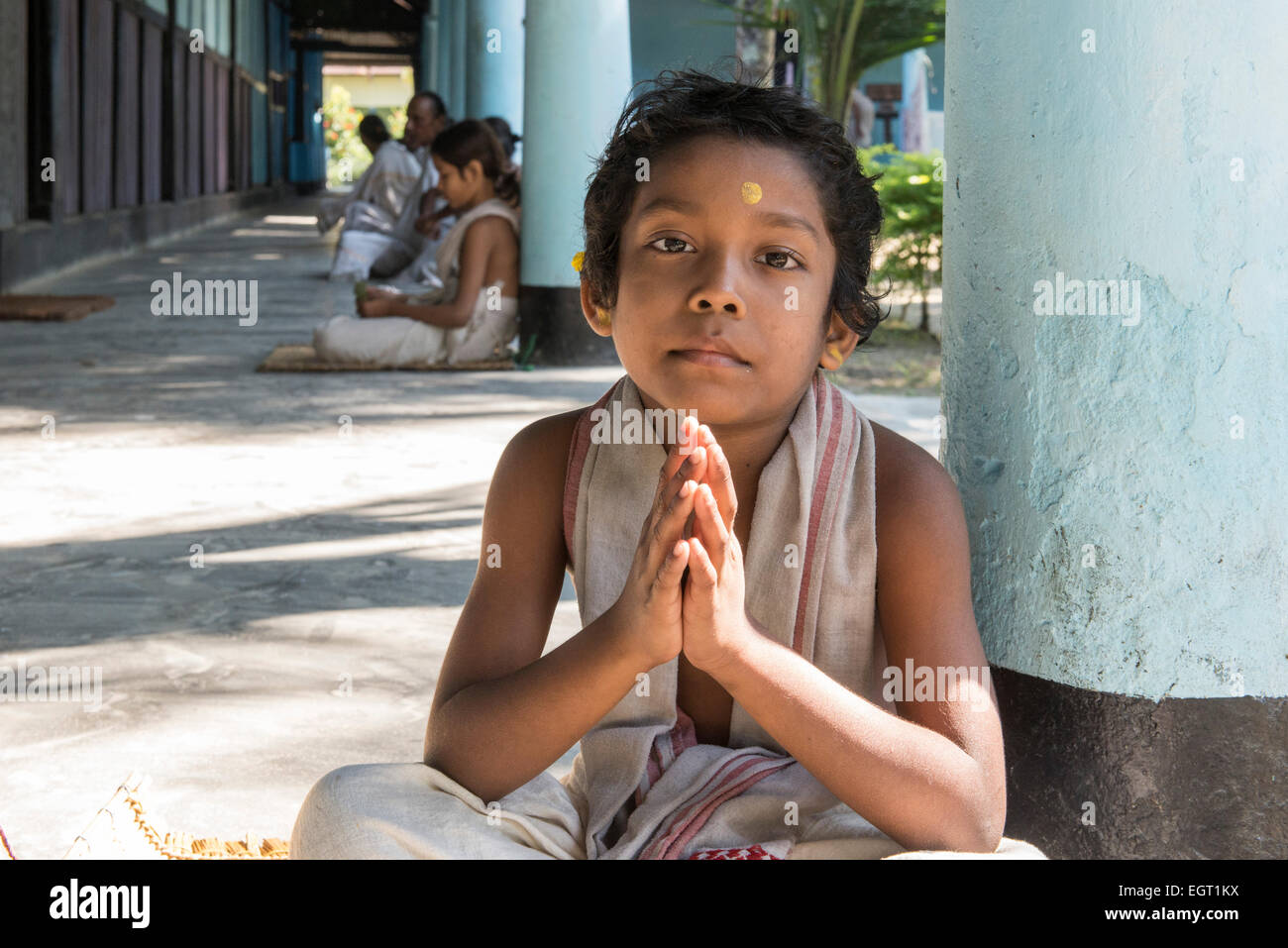 Young Monk Praying, Uttar Kamalabari Satra, Majuli Island Stock Photo