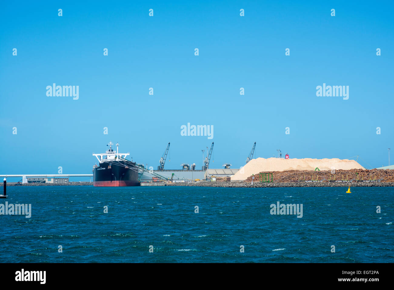 A ship loading cement in the coastal city of Portland Victoria Australia Stock Photo