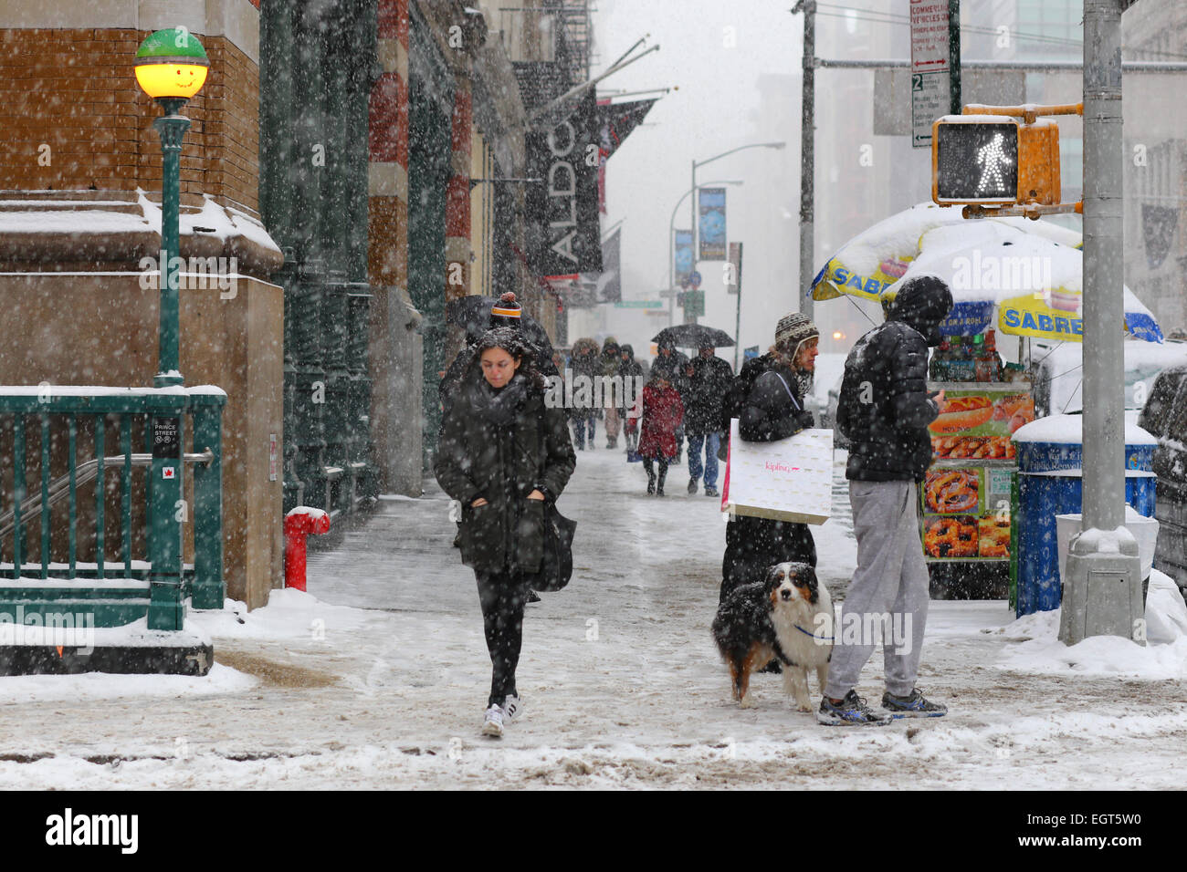 A snowy winter day in New York City. On the corner of Prince and Broadway, March 1, 2015 Stock Photo