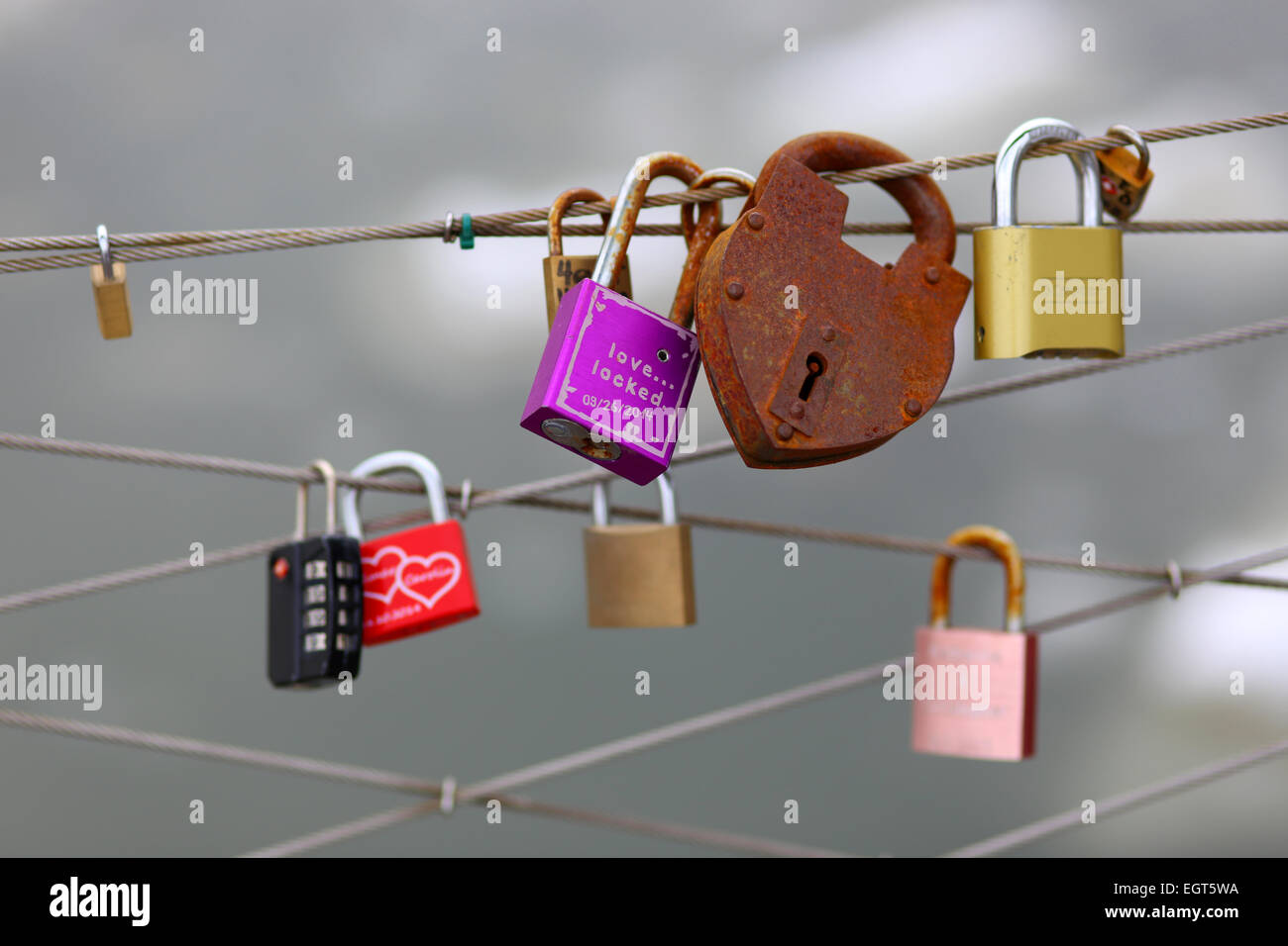 love locks chained to a fence Stock Photo