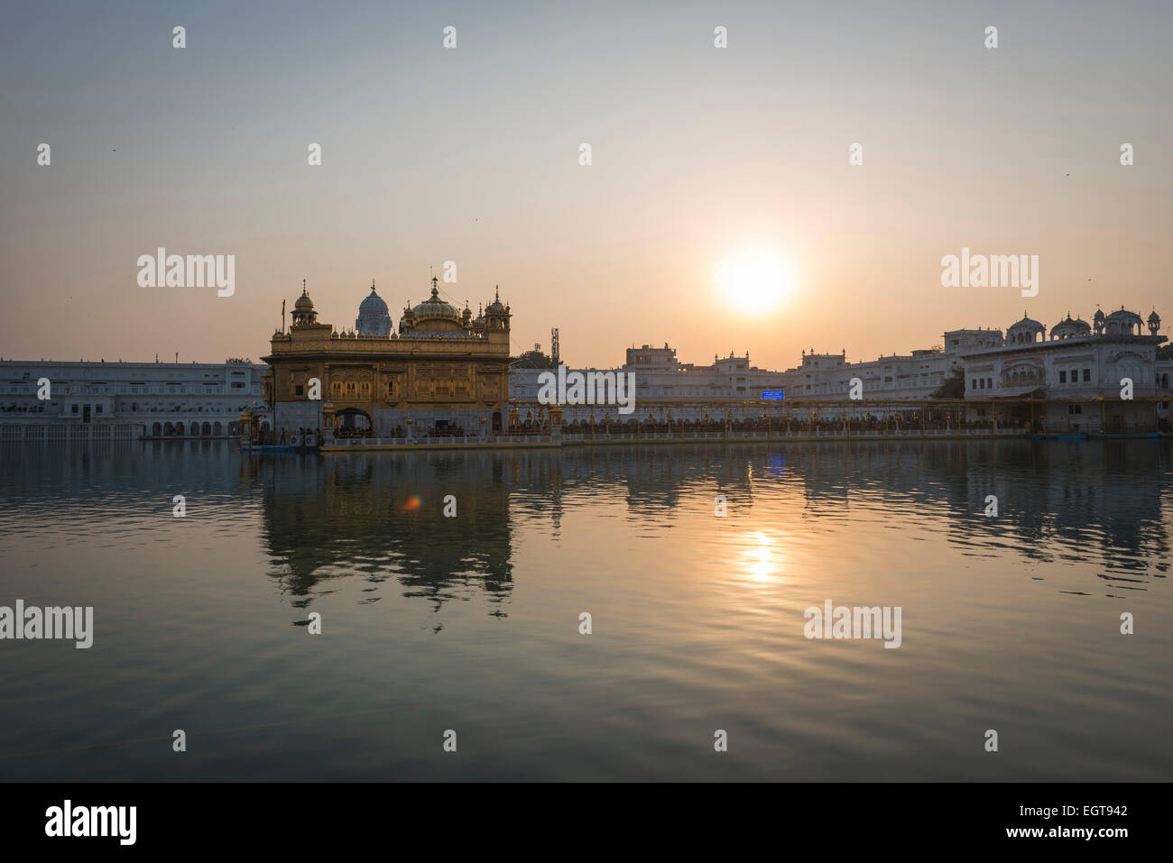 The Golden Temple of the Harmandir Sahib lit by the setting sun in Amritsar, India Stock Photo