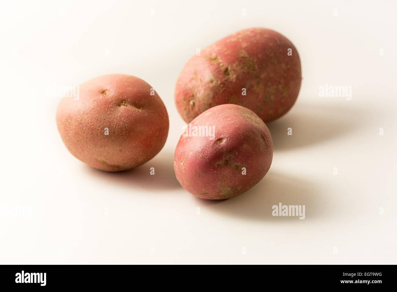 Three Raw Rooster Potatoes Stock Photo Alamy