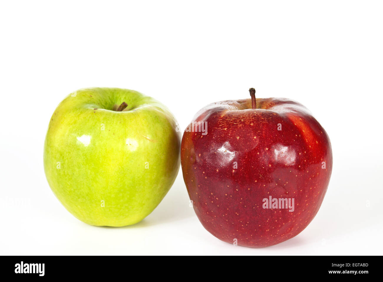 Organic green and red apple on a white background Stock Photo - Alamy