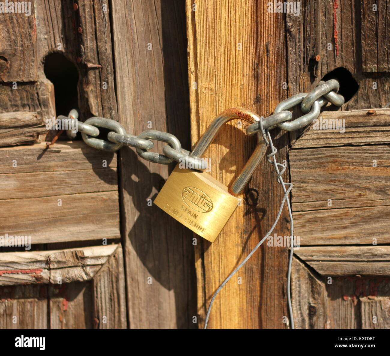 Padlocked and chained Old wooden panelled door. Vilaflor old town tenerife Stock Photo
