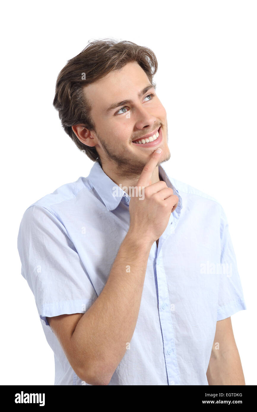 Young happy man thinking with hand on chin isolated on a white background Stock Photo