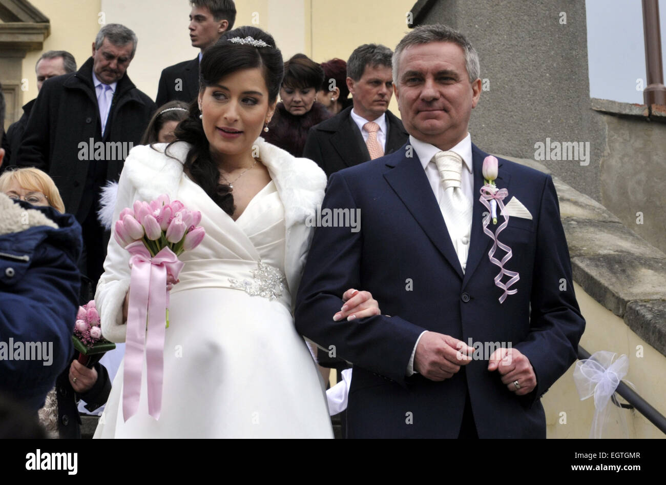 Head of the Presidential Office Vratislav Mynar, 47, married Czech Television (CT) presenter Alexandra Noskova, aged 31, with President Milos Zeman serving as the best man at the ceremony today, on Saturday, February 28, 2015. Mynar is a businessman from Osvetimany, where he is also a member of the local town hall. The marriage was held in a church. Most guests to it, including Zeman, came together in a coach. All of them, including Zeman, were greeted by a glass of plum brandy. In the summer, a boy will be born to the newly-wed couple. Due to her romance with Mynar, Noskova had to leave her j Stock Photo