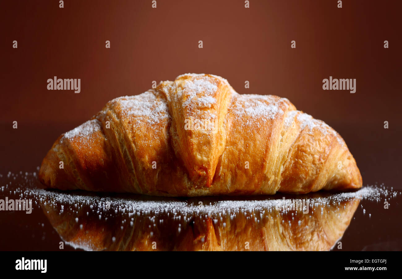 Fresh and tasty croissant with butter Stock Photo