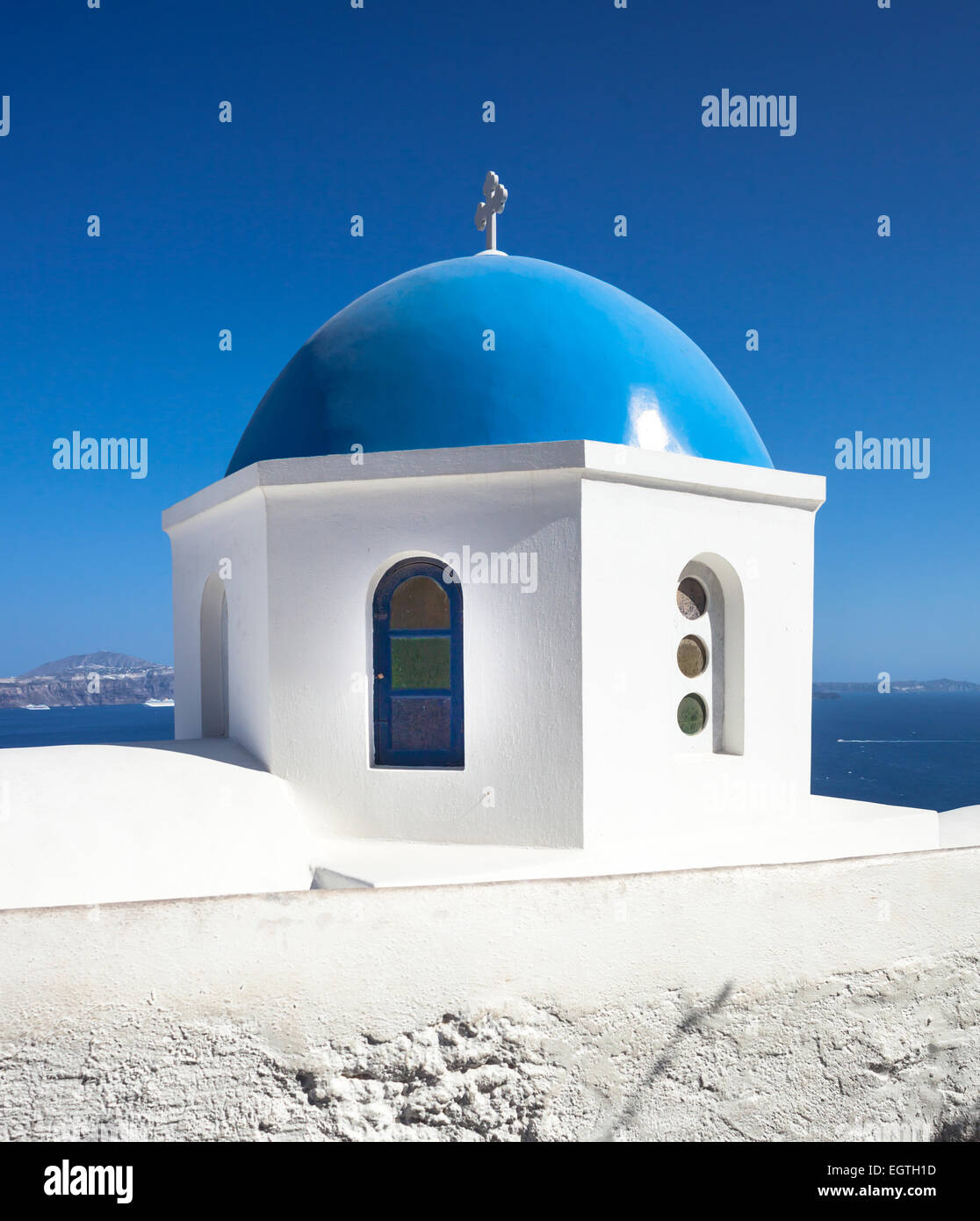 Traditional church with blue cupola at Oia Village, Santorini island in ...