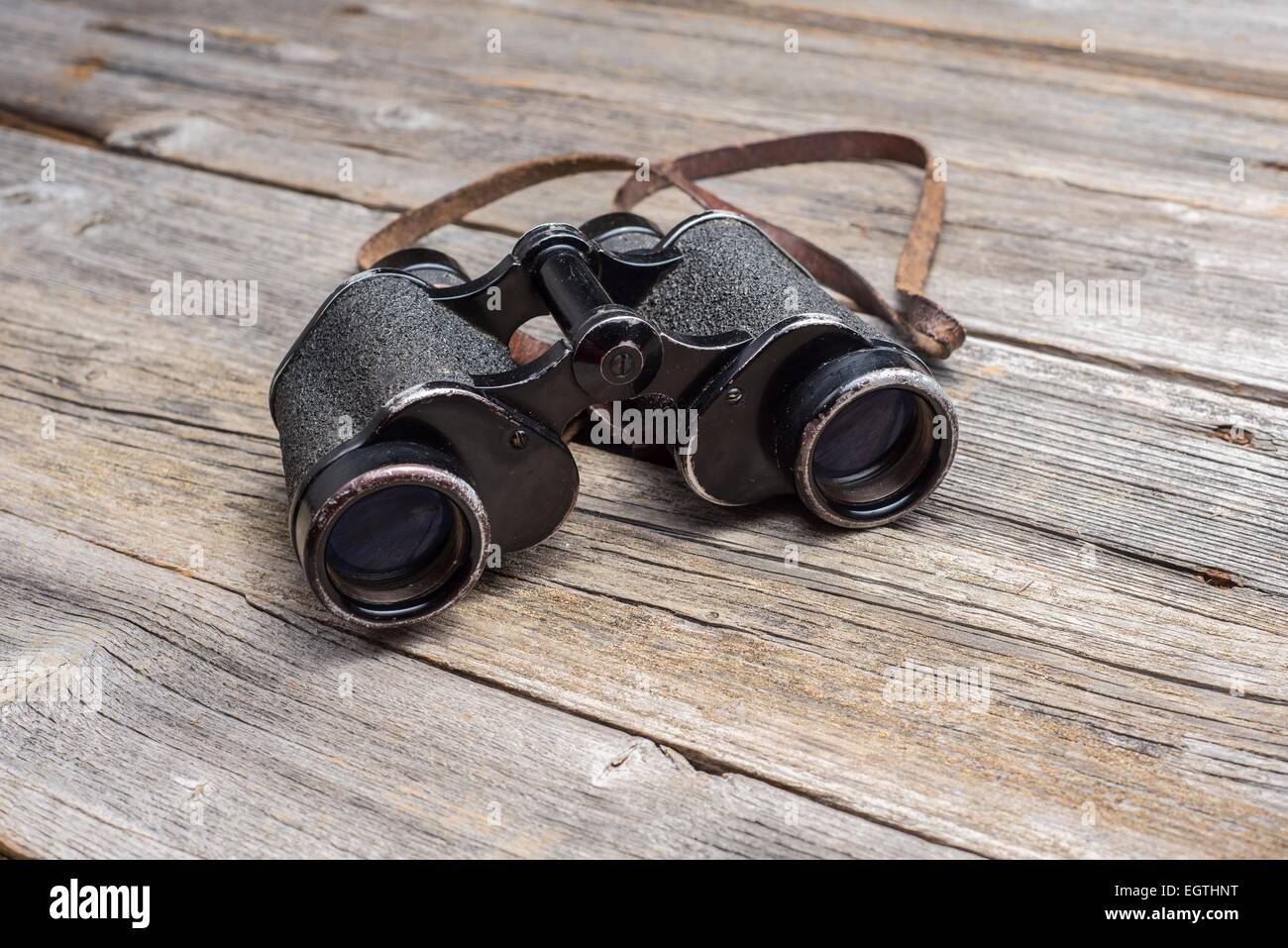 old vintage binoculars on wooden background Stock Photo