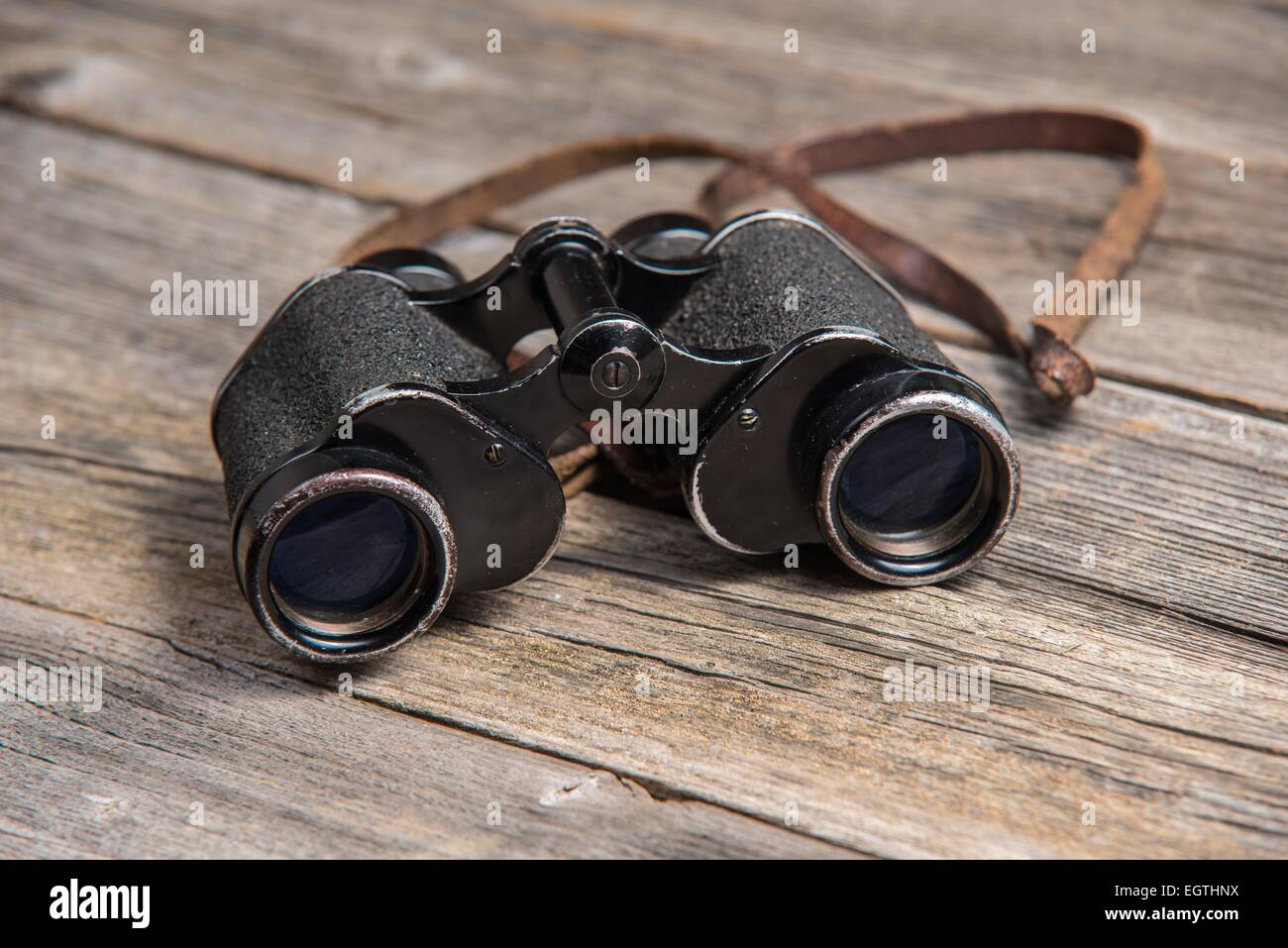 vintage binoculars on wooden background Stock Photo