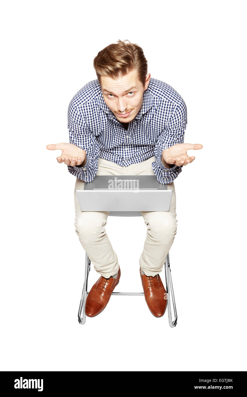 Young man working on a computer and throws up his hands. Stock Photo