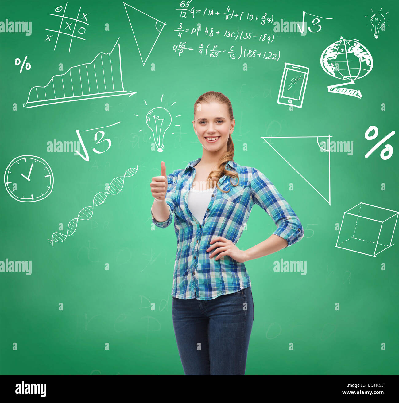 smiling student girl showing thumbs up Stock Photo - Alamy