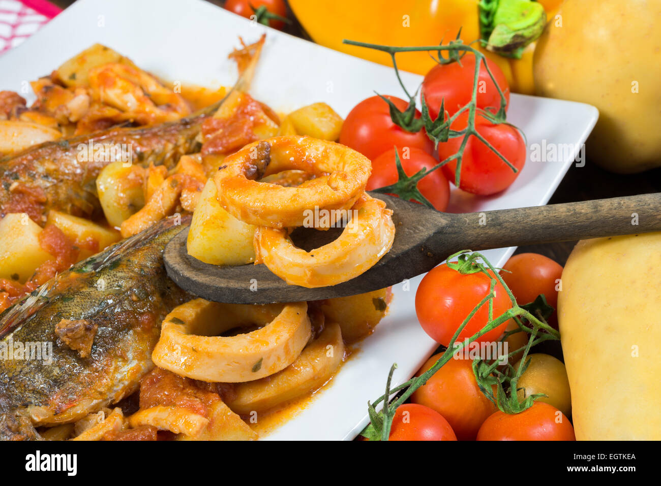 red gurnard soup with squid and potatoes Stock Photo