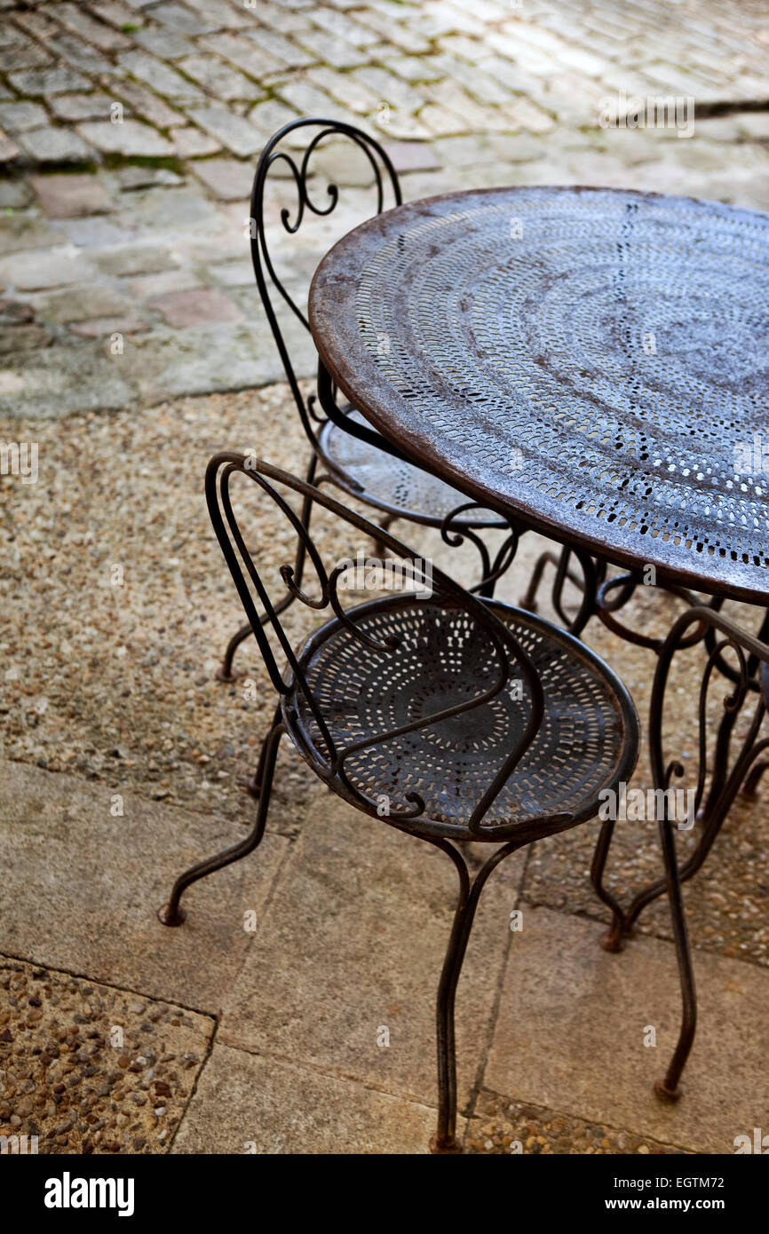 Iron table and chairs on a terrace Stock Photo Alamy