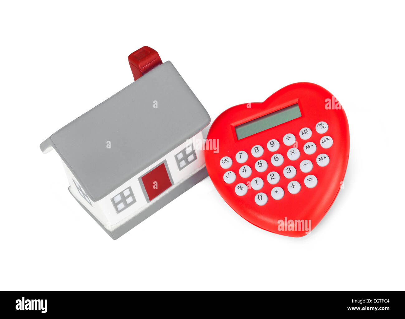 Calculator heart shaped and miniature house. Concept of purchase or mortgage. Stock Photo