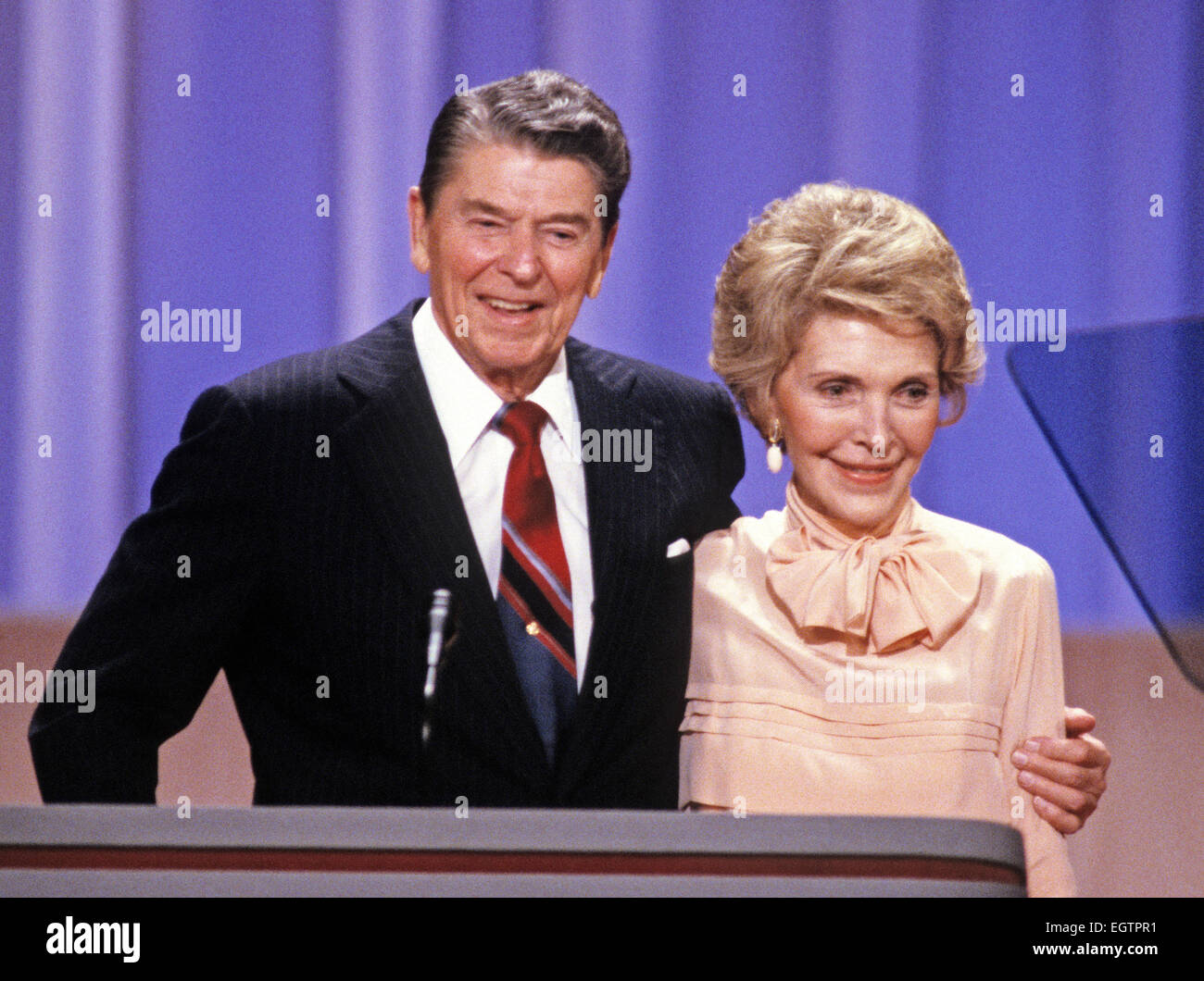 United States President Ronald Reagan and first lady Nancy Reagan on the podium of the 1988 Republican Convention as they acknowledge their supporters at the Super Dome in New Orleans, Louisiana on August 15, 1988. Credit: Arnie Sachs / CNP - NO WIRE SERVICE - Stock Photo