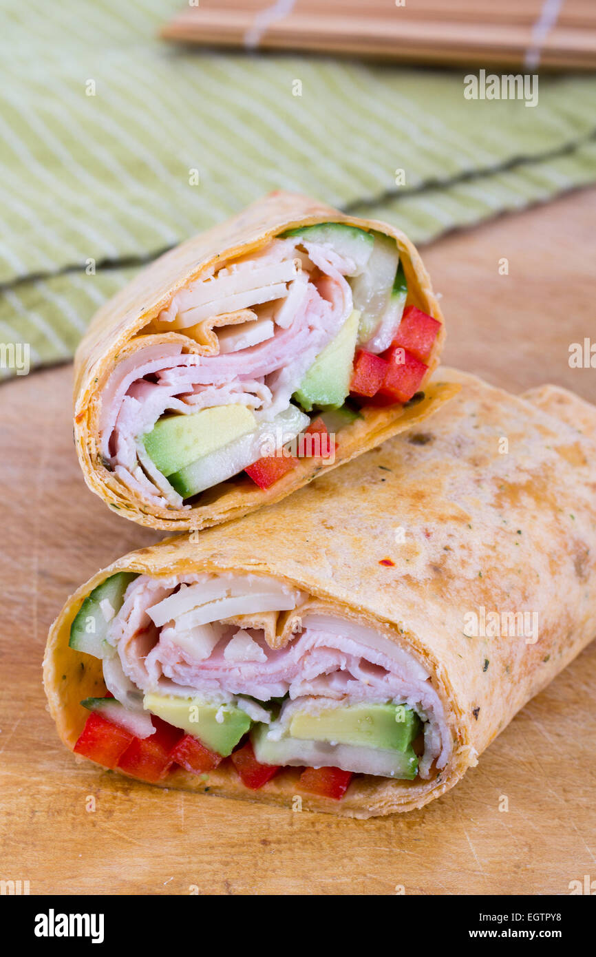 Ham and avocado sandwich wrap roll Stock Photo Alamy